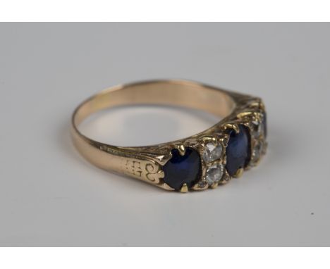 A gold, sapphire and diamond ring, mounted with three oval cut sapphires and two pairs of cushion shaped diamonds, weight 3.3