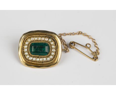 An early 19th century seed pearl and green gem set curved rectangular brooch, circa 1830, the central foil backed green gem w