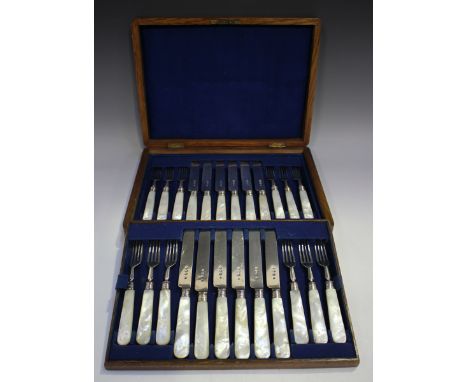 A set of twelve Victorian silver and mother-of-pearl handled dessert knives and forks, London 1895 and 1896 by Thomas Bradbur