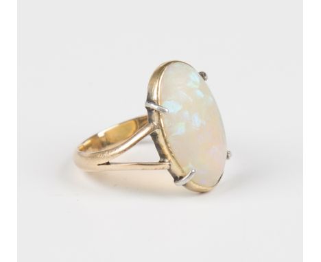 A gold ring, claw set with an oval opal, unmarked, weight 3g, ring size approx H.Buyer’s Premium 29.4% (including VAT @ 20%) 