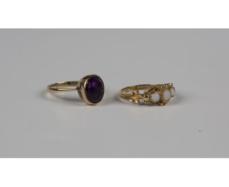 A gold ring, collet set with an oval cut amethyst, detailed '9ct', weight 3.2g, ring size approx P1/2, and a 9ct gold ring, m