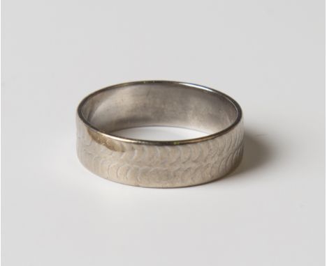 An 18ct white gold wedding band, weight 4.9g, ring size approx P.Buyer’s Premium 29.4% (including VAT @ 20%) of the hammer pr