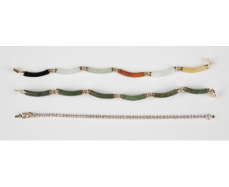 A gold mounted varicoloured jade curved baton link bracelet on a snap clasp, detailed '14K 585', weight 11g, length 19cm, a c