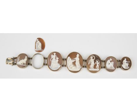 A mid-19th century gold and oval shell cameo bracelet, collet set with a row of six graduated oval shell cameos, carved as di