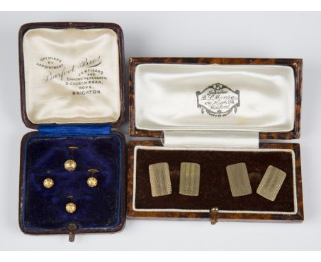 A pair of 9ct gold rectangular cufflinks with engine turned decoration, Birmingham 1946, weight 6.2g, with a case, and a set 