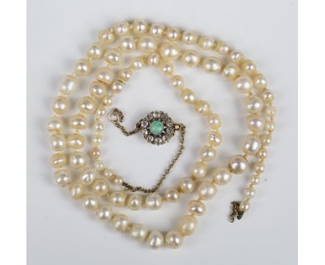 A single row necklace of graduated pearls, possibly natural saltwater, on a gold, opal and diamond cluster clasp, claw set wi