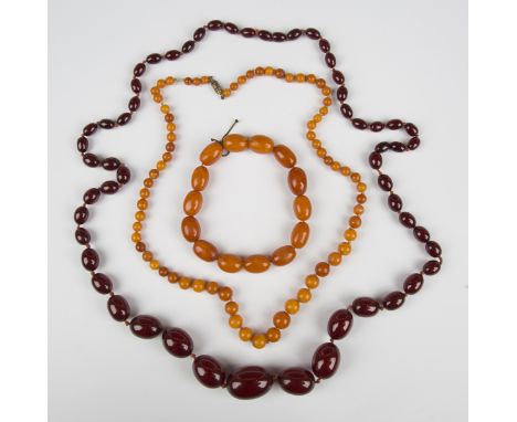 A single row necklace of seventy graduated spherical varicoloured butterscotch coloured amber beads, gross weight 19.1g, leng