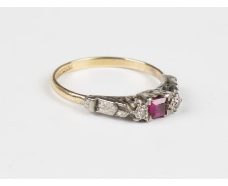 A gold, platinum, synthetic ruby and diamond three stone ring, mounted with a square cut synthetic ruby between two circular 