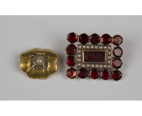 A 19th century gold, garnet and seed pearl rectangular brooch, glazed with a central locket compartment within a border of se