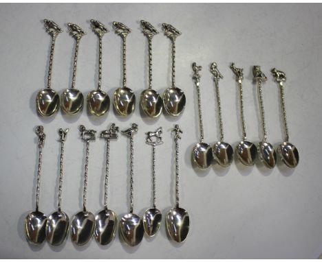 A set of five Edwardian silver coffee spoons, each with spiral twisted handle terminating in either a bird or animal, import 