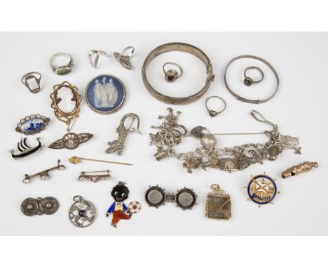 A group of silver jewellery, including a sterling curblink bracelet, fitted with various charms, and an oval hinged bangle, t