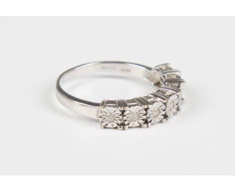 A 9ct white gold and diamond ring, mounted with a row of seven circular cut diamonds within flowerhead shaped settings, detai