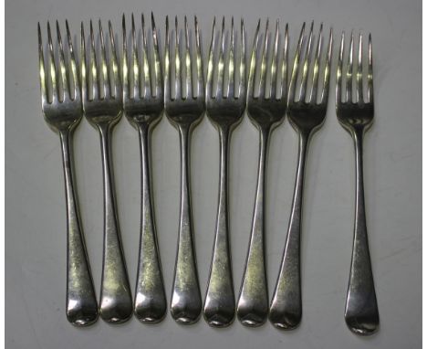 A set of seven George III silver Old English pattern table forks, London 1803 by William Eley and William Fearn, weight 473g,