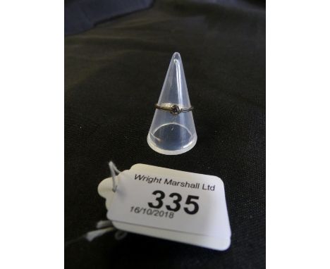 A diamond solitaire ring, the circular cut diamond collet with grooved shoulders, stamped 18ct, ring size L 1/2, weight appro