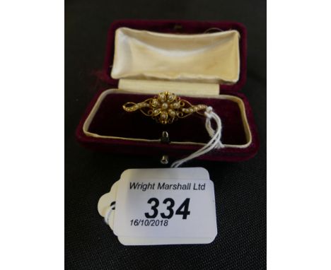 An early 20th Century split pearl brooch of floral design, the split pearl cluster with openwork sides within a fitted case, 