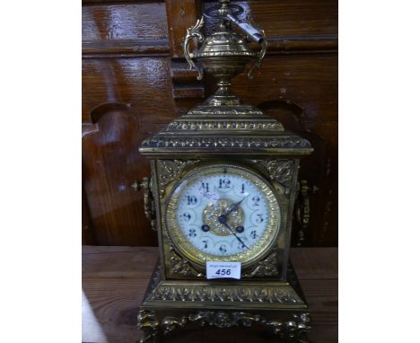 An early 20th Century Continental mantel clock in architectural case with looped handles and urn mount, fitted with a brass m