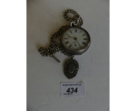 A silver open face pocket watch the circular white enamel dial with Roman numeral hour markers and subsidiary seconds dial, s