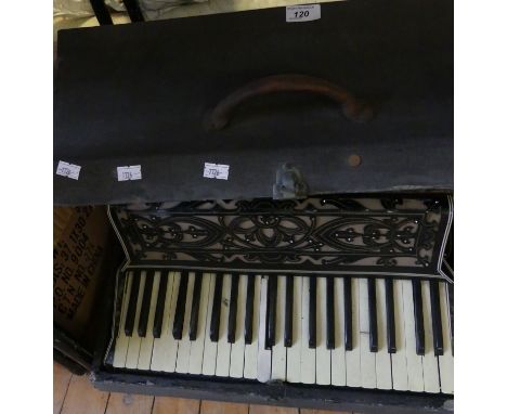 A cased Varsity piano accordion 