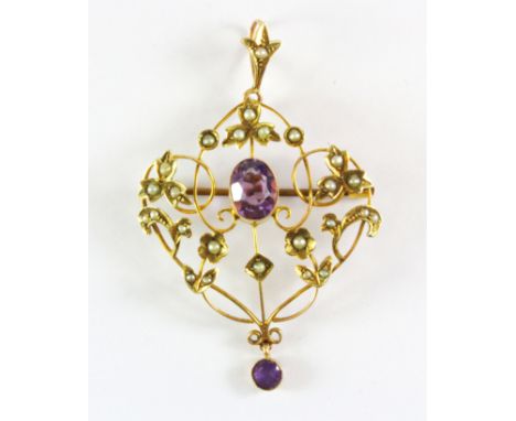 An Edwardian 9ct yellow gold amethyst and seed pearl set pendant/ brooch, L. 5.5cm.