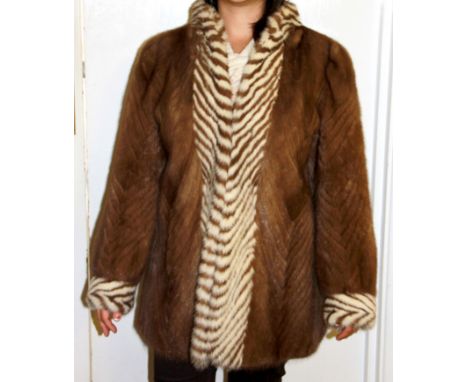A vintage mink jacket by Glyn and Leinhardt of Manchester with a 1983 insurance valuation, L. 75cm.