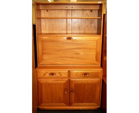 An Ercol bureau bookcase.