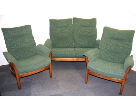 An Ercol two seater settee and two armchairs.