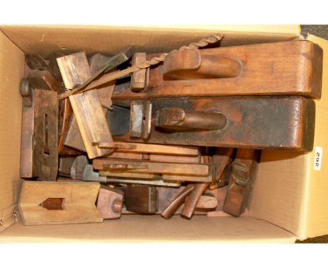 A quantity of early woodworking tools including shaped plains.