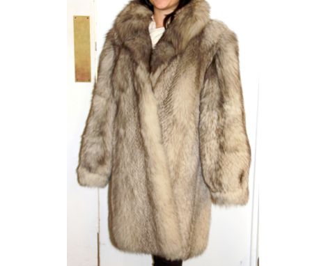 A superb ladies vintage blue fox fur coat, L. 103cm, with re-styling receipt for 1994.