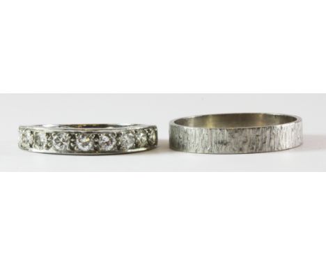 An 18ct white gold diamond set half eternity ring and an 18ct white gold ring, overall approx. 9.1g, (R & U).