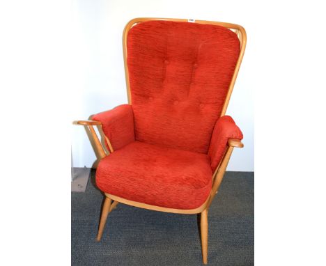 An Ercol high backed armchair.