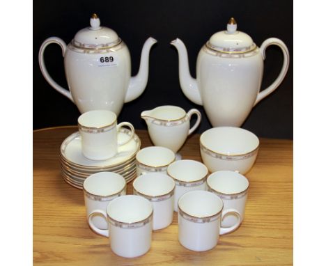 A Wedgwood Colchester pattern coffee set with two coffee pots and eight cups and saucers.