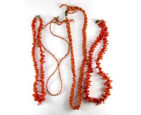 Four vintage coral necklaces.