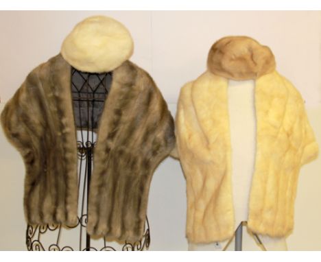 Two vintage fur stoles and two hats.