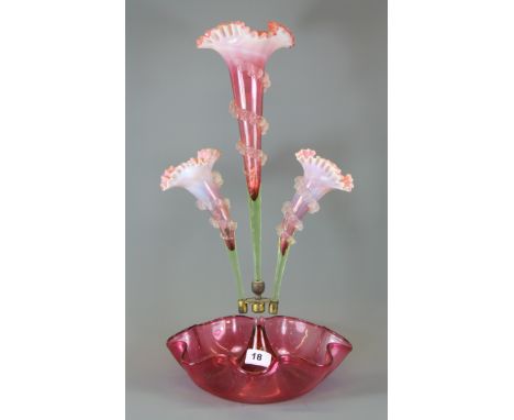 A Victorian cranberry and opaline glass three branch epergne, H. 50cm.