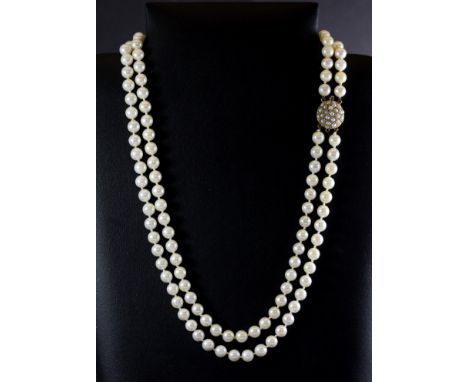 A two row pearl necklace with a 9ct yellow gold seed pearl set clasp.