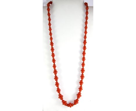 A strand of 1920's faux coral beads, L. 74cm.