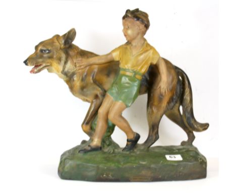An Art Deco ceramic figure of a boy with an Alsatian dog entitled "Good companions", H. 40cm.