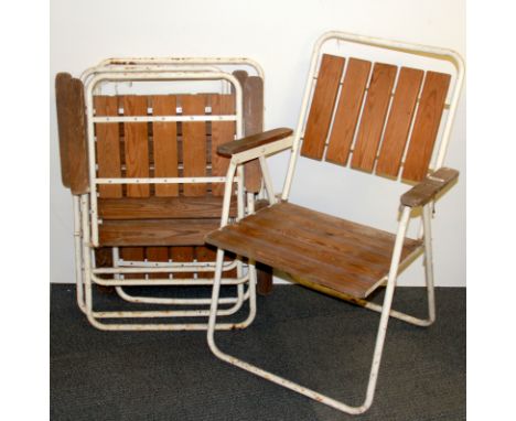 A set of four vintage wood and tubular steel garden chairs.