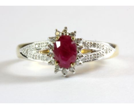 A 9ct yellow gold ruby and diamond set cluster ring, (M.5).