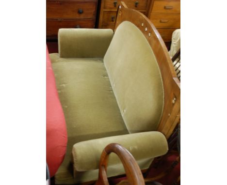 A Scottish School style late Arts & Crafts mahogany framed and green upholstered two seater sofa, having mother of pearl flor