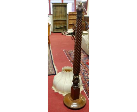 A mahogany spiral reeded standard lamp
