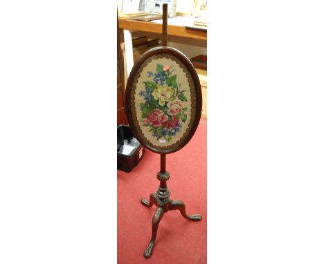 A 19th century carved mahogany and tapestry floral inset pole screen