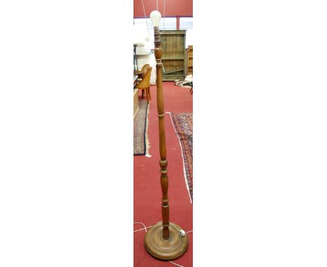 A turned walnut standard lamp 