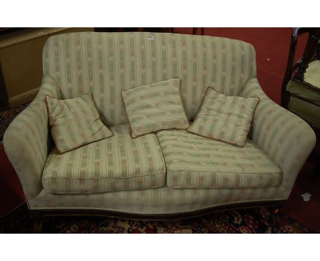 An early 20th century walnut framed and stripe upholstered two seater sofa