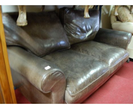 A contemporary chocolate brown leather upholstered two seater sofa