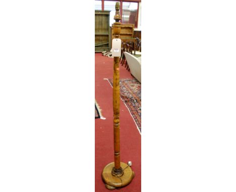 A turned oak standard lamp