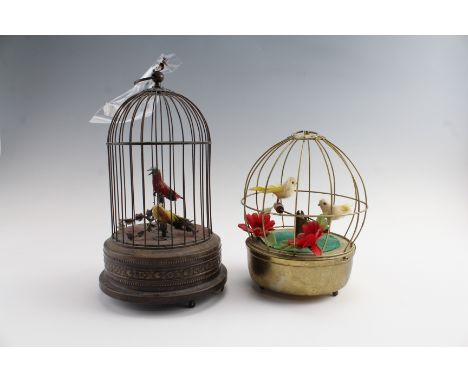 Two mid-to-late 20th Century automaton song birds in cages, tallest 21 cm, (tallest one bird head detached)