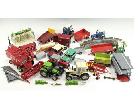 A large group of Britains Ltd diecast farm vehicles, buildings and accessories, including Farm Builder, a combine harvester, 