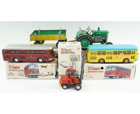 A boxed Kovap tinplate clockwork Zetor tractor and trailer together with two boxed tinplate Autobus 1959 busses and a Desta 1