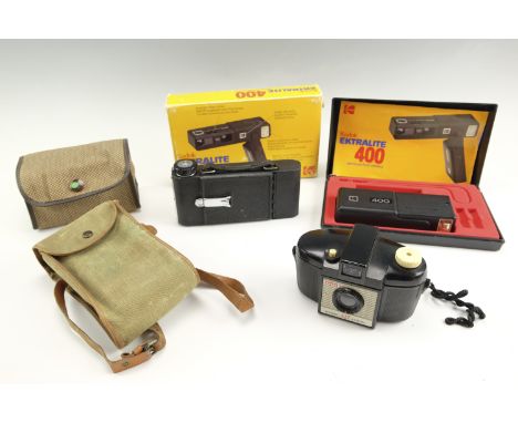 A Kershaw Penguin roll film camera together with a Kodak Brownie 127 and an Ektralite 400